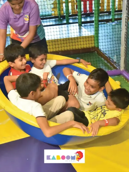 A whole group of friends enjoying the spinner ride, with our staff making sure everyone is safe.