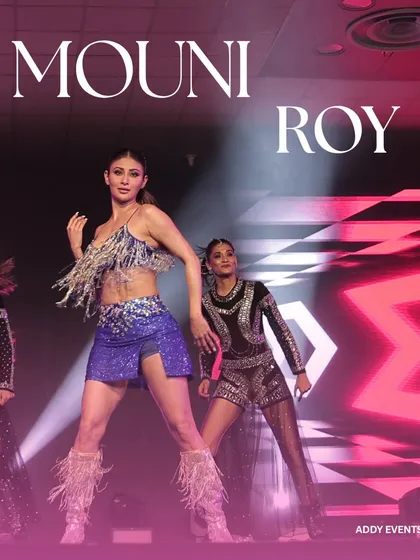 A powerful shot of Mouni Roy owning the stage at a luxury corporate gala. We specialize in booking and managing celebrity performers who can elevate a corporate event from a simple gathering to a spectacular affair.