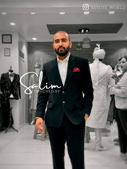 A client in a classic, perfectly tailored black suit. This demonstrates my core belief that a great fit is the foundation of all style.