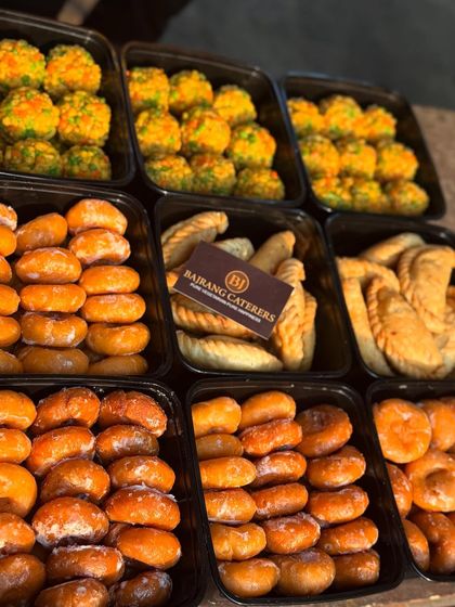 All our festival orders are packed hygienically in convenient trays. This image shows a bulk order of our Holi sweets, showcasing the care I take in preparing and delivering your food.