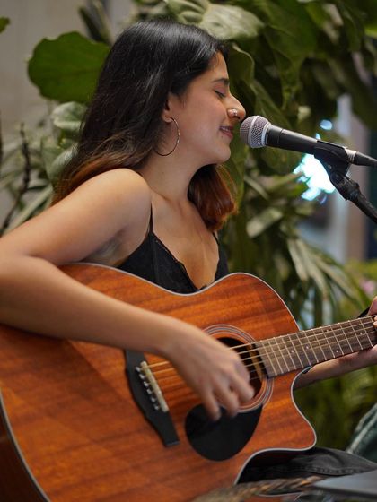 A candid smile during my set at RCB Bar & Cafe. I love when the vibe is relaxed and conversational.