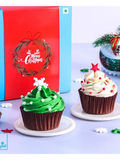 Another look at our festive Christmas cupcakes. These are perfect for office parties, family gatherings, or as a sweet gift. The bright green frosting and snowflake sprinkles add a touch of holiday cheer.