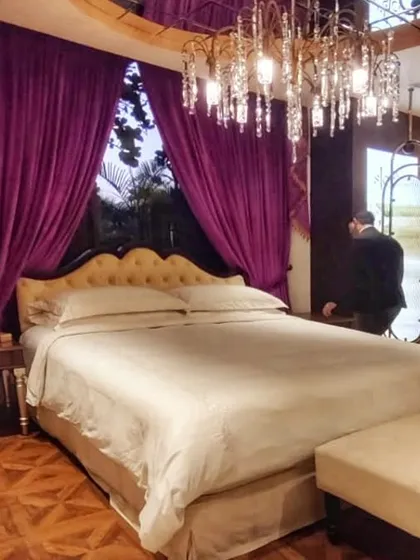Creating a complete sensory experience at the Sleeep Boutique. This setup shows how we integrate luxury bedding, dramatic crystal chandeliers, and rich textiles to design a truly immersive retail environment.