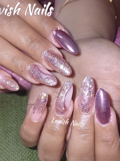 A mix of textures with metallic mauve and chunky rose gold glitter on long almond-shaped nails.