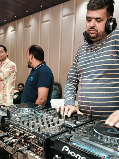 Working the turntables at a private event. I'm always focused on delivering the best musical experience.