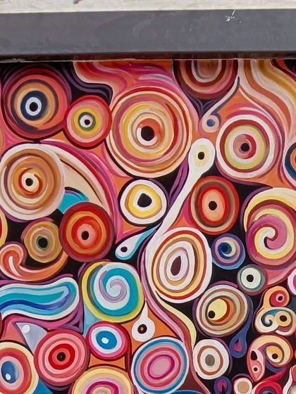 A detailed section of the abstract Marilyn Monroe mural, showing the intricate swirl patterns.