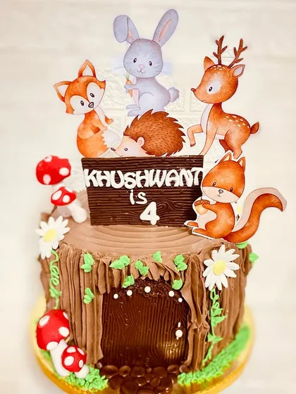 A different angle of our adorable woodland theme cake, showing all the little animal friends.