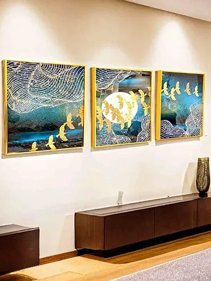 A beautiful set of three crystal paintings showing golden birds in flight against a teal and moonlit sky. The flowing lines and shimmering gold details create a sense of movement and magic.