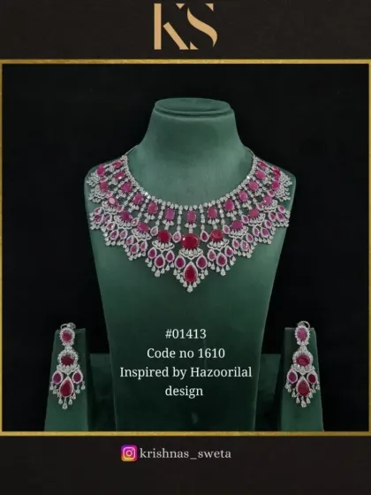 A premium American diamond set inspired by Hazoorilal designs. This ruby red version features a wide, sparkling necklace and matching earrings for a truly luxurious feel.