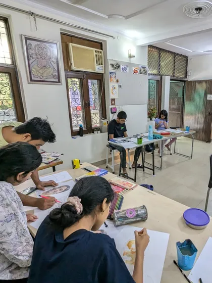A snapshot of our classroom in action. Students are deeply focused on their portrait and figure drawing exercises.