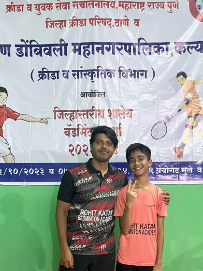 Posing with the first-place winner of the under-14 individuals at the KDMC DSO tournament.