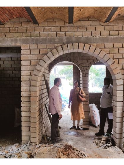 A site visit to the 'VKR' project, discussing the details of the brick arches with the client and team.