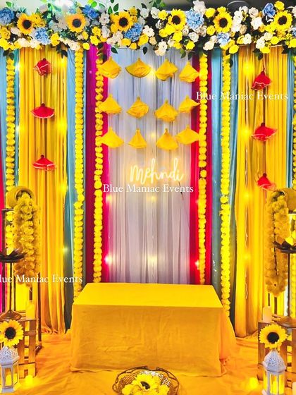 The final look of the vibrant and compact Mehendi setup. This shows that even a small space can be transformed into a full-vibe celebration corner.