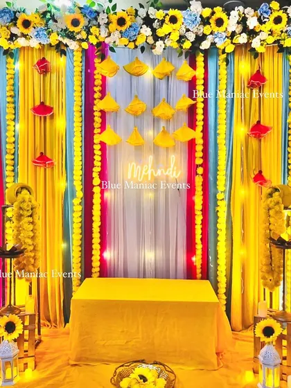 The final look of the vibrant and compact Mehendi setup. This shows that even a small space can be transformed into a full-vibe celebration corner.