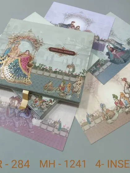A luxurious boxed invitation that tells a story with its artwork, featuring a royal couple and various wedding scenes. This set includes four inserts and a ribbon pull for an elegant touch.