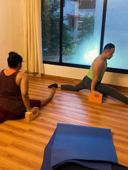 Another example of using blocks to support the splits. This allows students to work on their flexibility without forcing the body, ensuring a safe and effective stretch.
