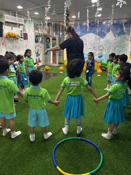 A coach leads a fun activity with our pre-school group. Our sessions for young kids are filled with games that teach fundamental movement and coordination.