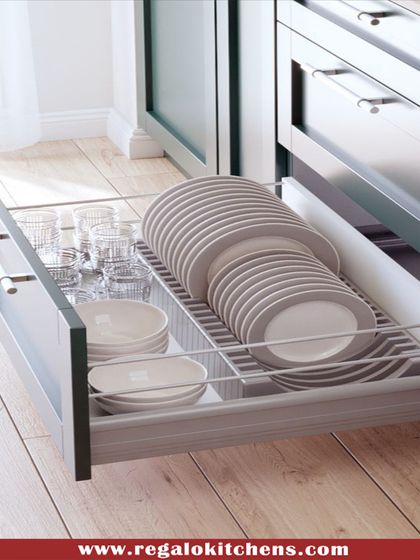 Our drawer solutions are designed for real-life use. This deep drawer features custom dividers for plates and bowls, keeping them secure and preventing chipping. The smooth, full-extension runners provide easy access.