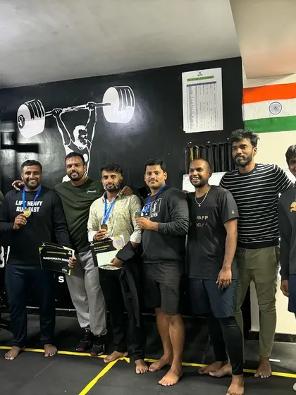 The team celebrating together. These events are about more than just lifting, they are about our shared passion for fitness.
