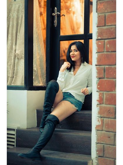 A classic, smiling portrait that feels warm and inviting. It shows that even in a location with a lot of character, the focus is always on the person.