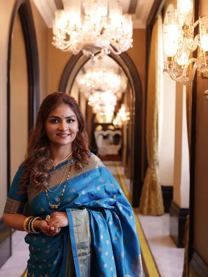 An elegant portrait taken in a grand hallway, showcasing the timeless beauty of the look.
