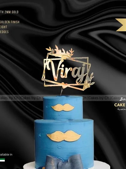 A mockup of the "Viraj" birthday topper on a stylish blue two-tiered cake, perfect for a modern celebration.