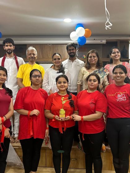 The complete winning women's team, "Yogini," posing with their trophy. Their teamwork and spirit are an inspiration to us all.