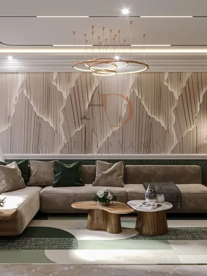 A nature-inspired living room with a textured wall resembling mountain ranges, complemented by a soft color palette and a geometric rug.