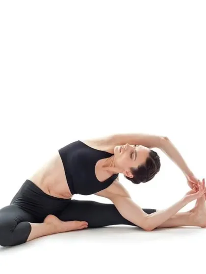 Parivrtta Janu Sirsasana, the Revolved Head-to-Knee Pose. This seated twist and side bend stretches the spine, shoulders, and hamstrings.