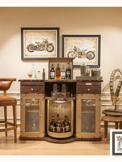 The Barn bar begins its transformation. The top section lifts to reveal the upper storage, while the central revolving section for bottles starts to become visible.