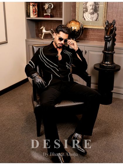 Another seated pose, this time with a thoughtful expression. The shirt is as versatile as the man who wears it.