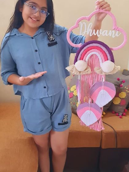 It's so rewarding to see my creations with their new owners. Here is a happy customer proudly showing off her custom 'Dhwani' nameplate in a beautiful pink and purple color scheme.