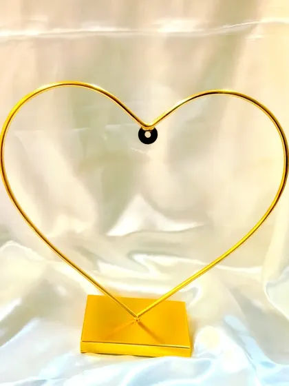 This heart-shaped metal stand is a new addition to our store. It's perfect for displaying a custom ring platter or a personalized photo frame, adding a touch of romance to the presentation.