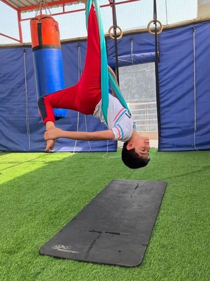 How cool do we look in the air? This inverted pose is a favorite, making them feel like they are floating in space.