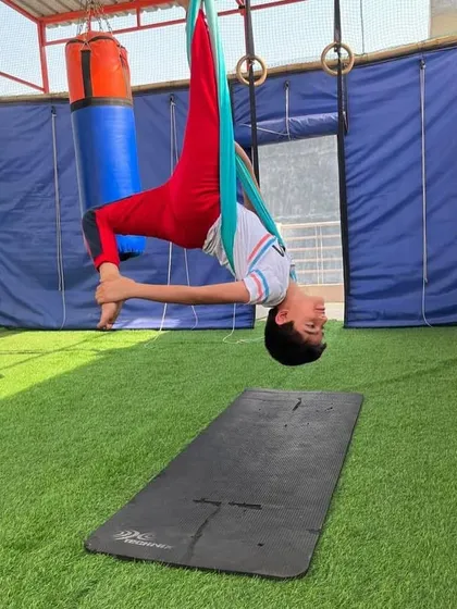 How cool do we look in the air? This inverted pose is a favorite, making them feel like they are floating in space.