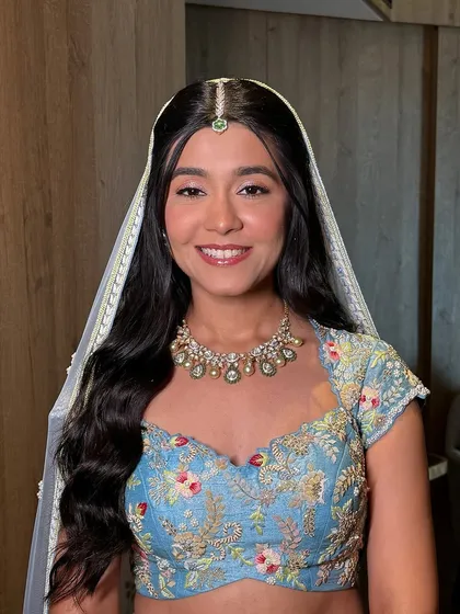 A radiant bride ready for her Mandap Muhurat. I created a soft, glowing look with gentle eye makeup to give her a fresh, princess-like appearance for her ceremony.