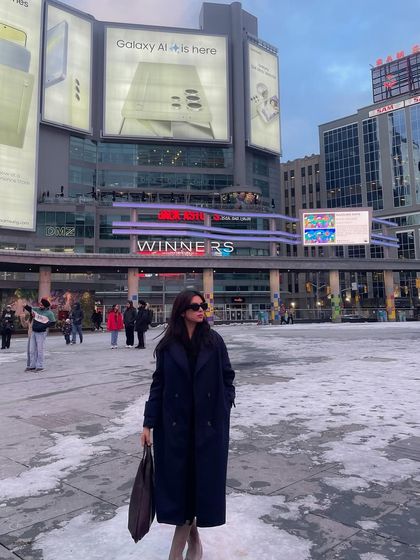 A winter shot in downtown Toronto's Dundas Square. This shows my ability to create compelling urban content even in cold weather, capturing the energy of the city.