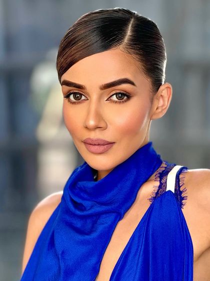 Another shot of this incredible look. The makeup is minimal but impactful, letting her confidence shine through.