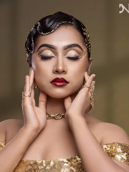 The eyes are closed, but the glamour is wide open. This shot highlights the flawless blending and artistry of the eye makeup.