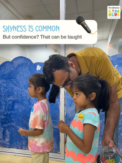Shyness is common in children, but confidence is a skill that can be taught. Here, a mentor gently encourages two children, helping them feel comfortable and supported.