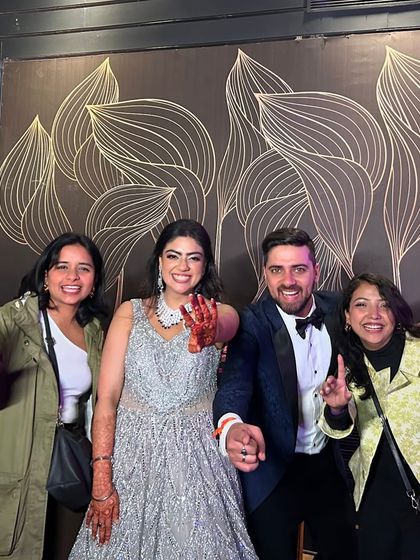 This wedding was an overwhelming experience and this is what clients turning into family truly means. A happy picture with the couple.