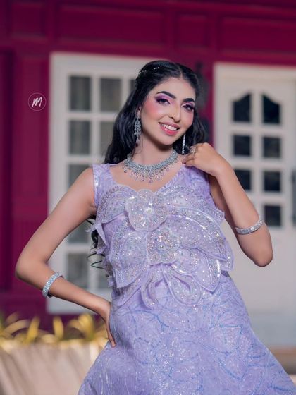 A full view of the sparkling lavender gown. This is a perfect look for a cocktail party or a modern reception.