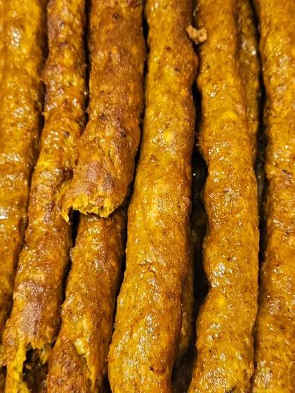A close look at my freshly prepared Mutton Seekh Kebabs. They are juicy, full of spices, and perfect as a starter for any event. I sell these by the kilo.