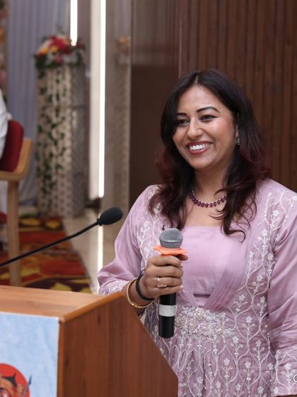A smiling moment from the stage of the Jain Mewad Bisa Oswal Sangh event. These events are more than a job; they are a way for me to connect with my roots and serve my community.