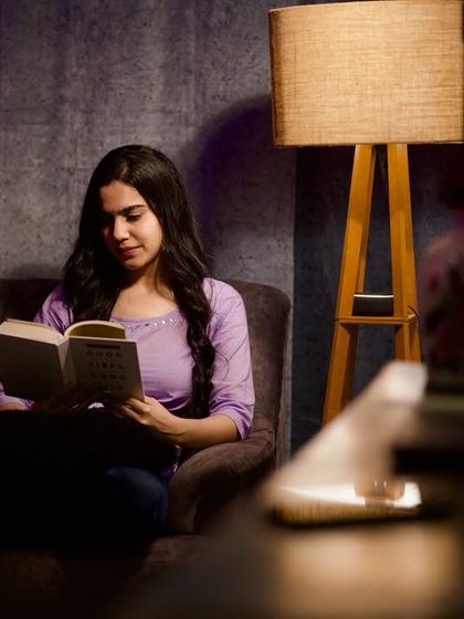 Lost in a good book. This shot is part of a series creating a cozy, peaceful atmosphere, showcasing my ability to portray different moods and characters for the camera.