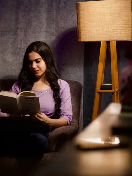 Lost in a good book. This shot is part of a series creating a cozy, peaceful atmosphere, showcasing my ability to portray different moods and characters for the camera.