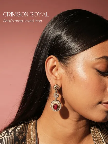This is my most-loved icon, the Crimson Royal earring. It is a regal composition of ruby, amethyst, citrine, pearls, and diamonds, woven together to create a piece of pure royalty for your collection.