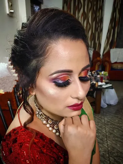 A side view of the creative eye makeup, showing the dramatic false lashes.