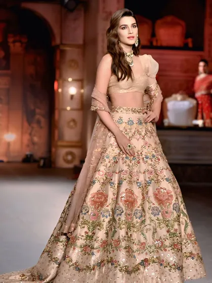 On the runway, every detail matters. Here, I captured actress Kriti Sanon in a full-length shot, showcasing the intricate embroidery and graceful flow of her stunning lehenga.