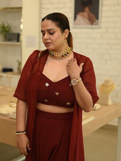Another guest at our private showcase, trying on a stunning multi-colored necklace. These events are a wonderful way to explore different styles in a relaxed and intimate setting.